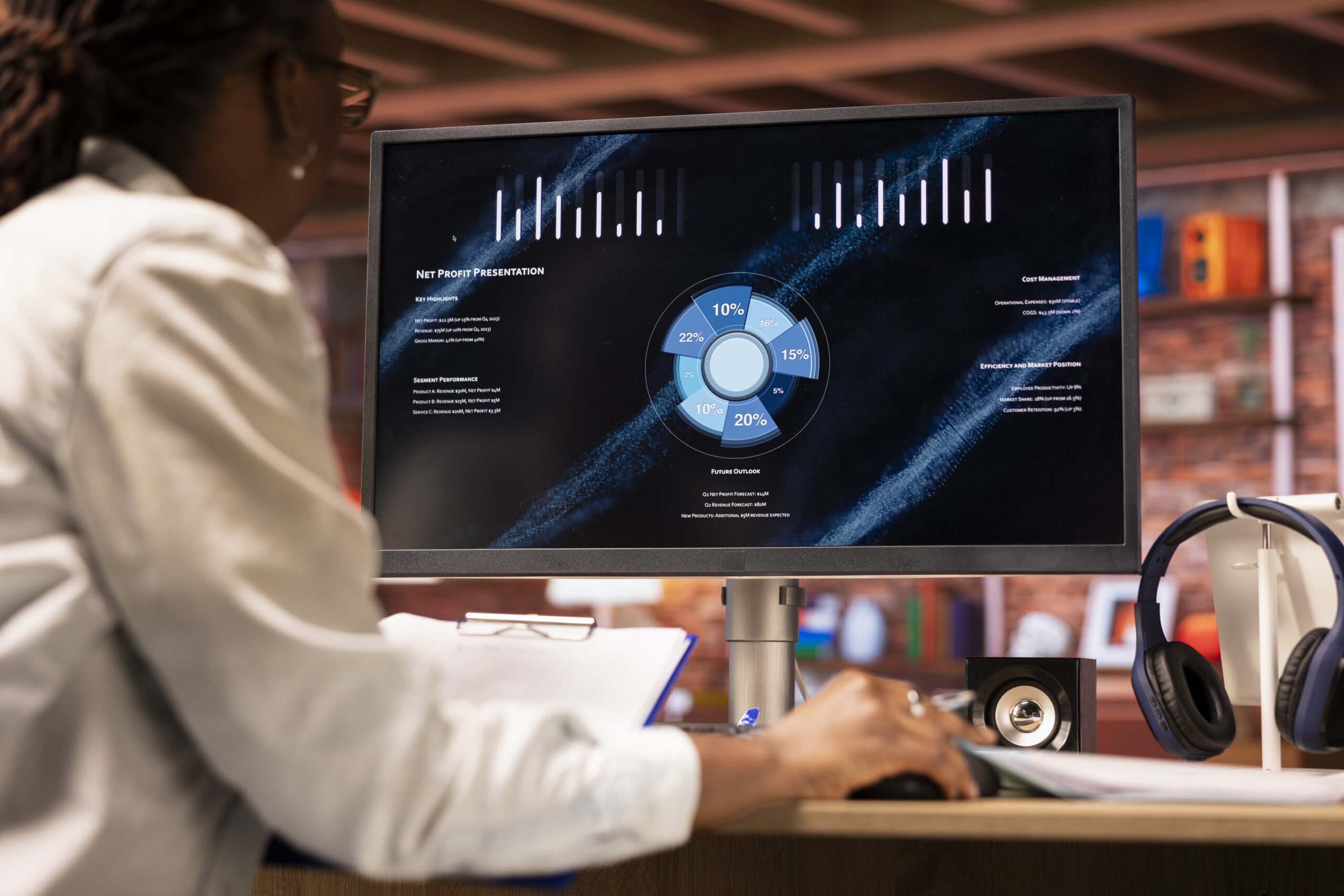 woman looking at data on computer